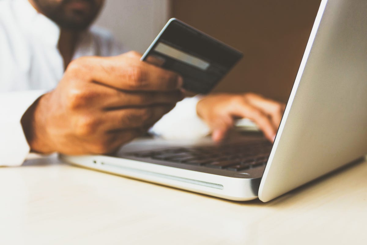 Photo of a man holdinga a credit card